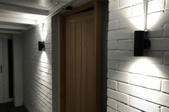 Bespoke oak door and frame with modern up and down lights.